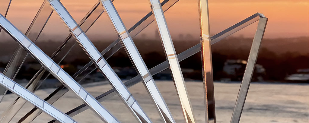 collection of images of clear perspex models with scenic backgrounds of the ocean and sky