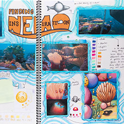 Close up of visual arts diary displaying progress images for a body of work